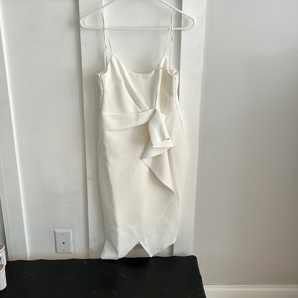 Asymmetrical white midi dress with ruffle detail